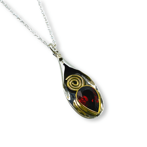 Garnet pendant with brass overlay